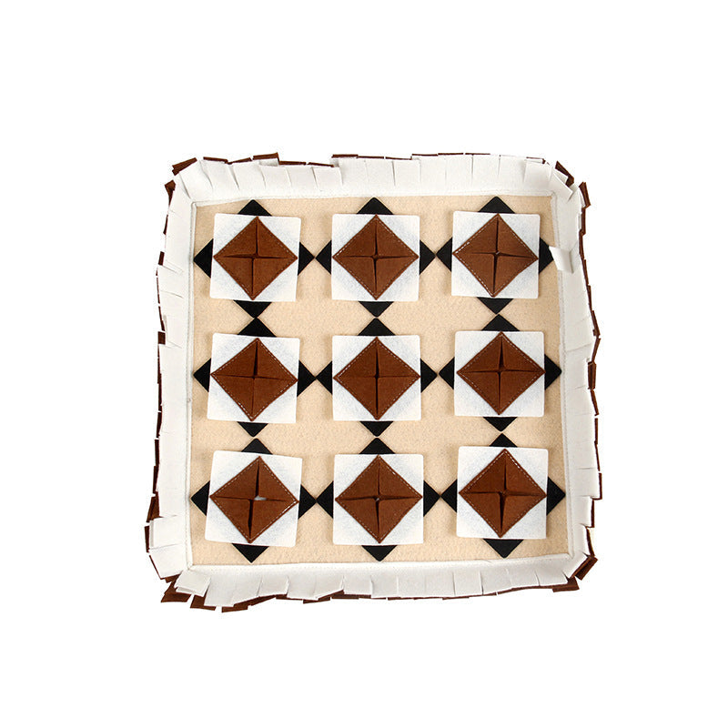 The dog sniffs the mat
